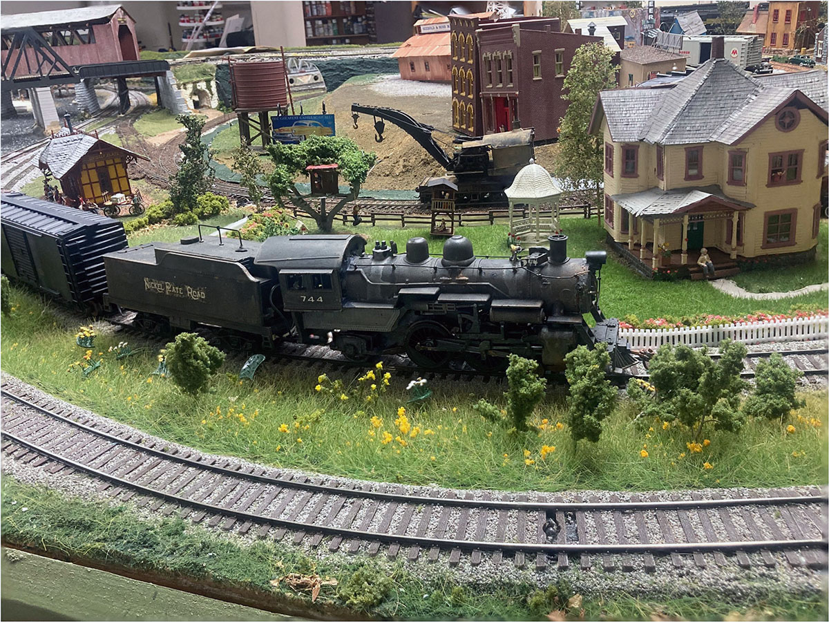 Greg Harter sent a snap of a scene from his NYC and NKP layout staring a kit built Nickel Plate 4-4-2 and way freight. A Campbell Models' “Grandma's House” kit is shown on the right.